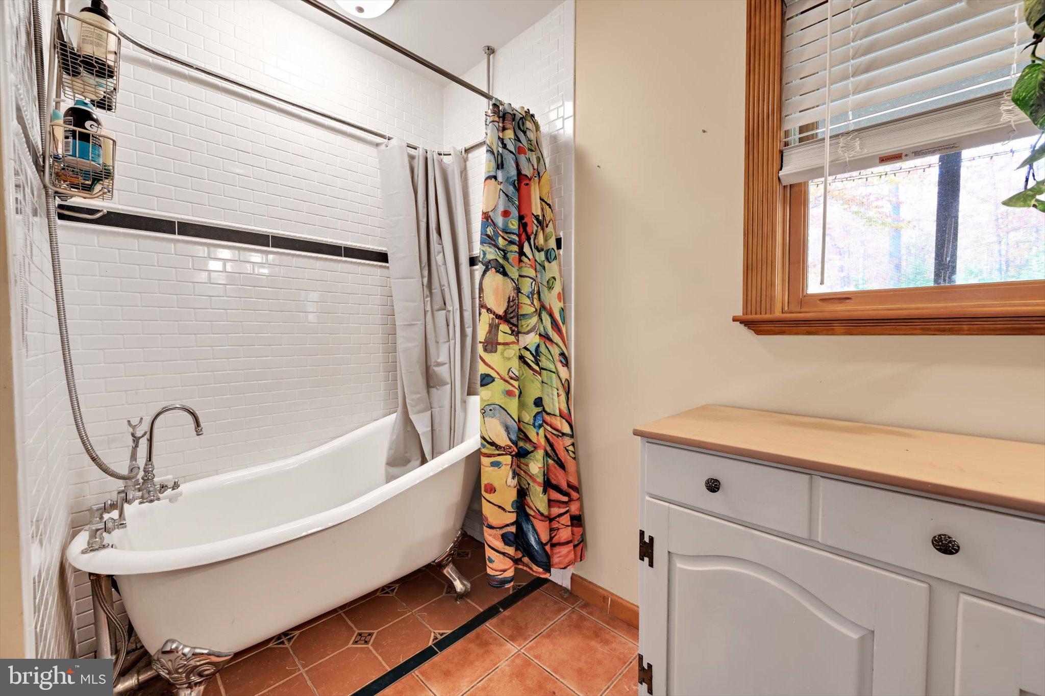 309 Club Road Bethel, PA 19507 - Photo 18 of 49 a bathroom with a sink and a bathtub