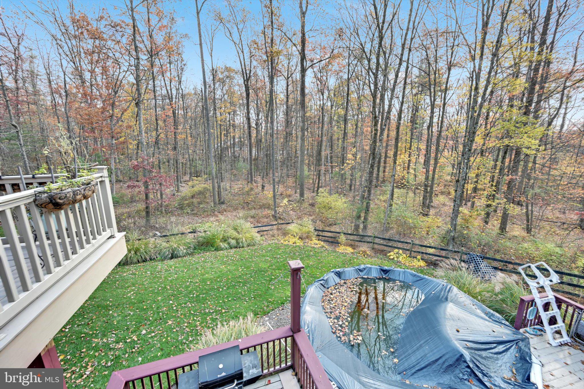309 Club Road Bethel, PA 19507 - Photo 32 of 49 a view of a chairs and table in backyard
