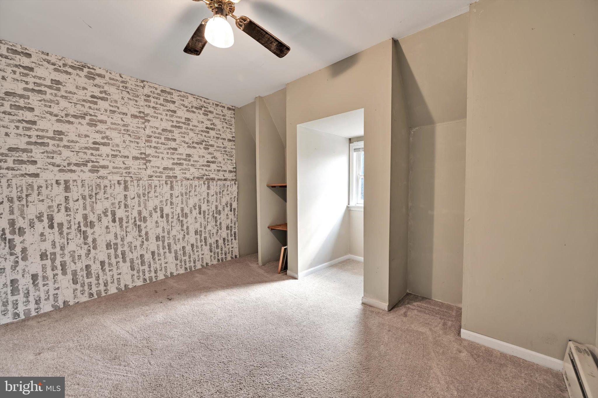 309 Club Road Bethel, PA 19507 - Photo 39 of 49 an empty room with fan and entrance