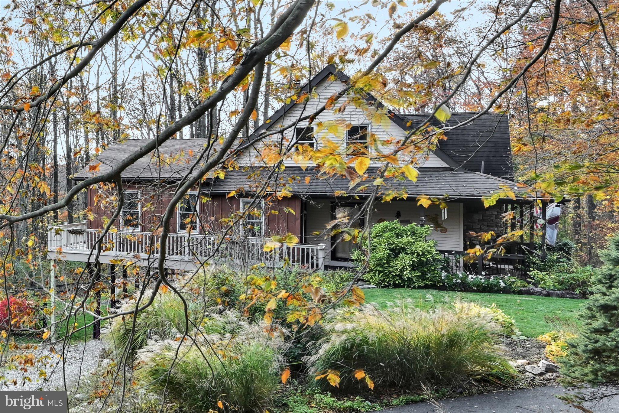 309 Club Road Bethel, PA 19507 - Photo 44 of 49 a view of a house with a yard and potted plants
