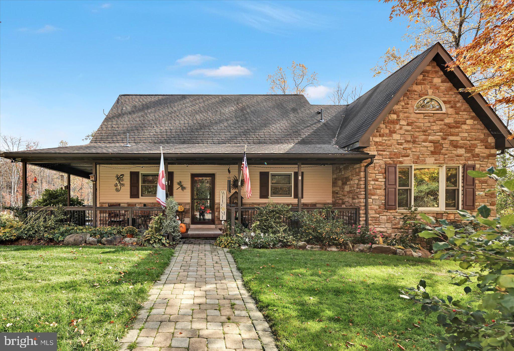 309 Club Road Bethel, PA 19507 - Photo 48 of 49 a front view of a house with garden