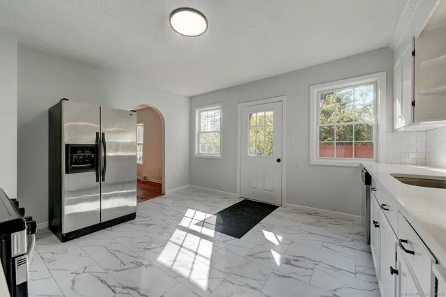 a kitchen with a cabinets and window