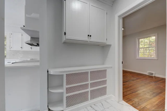 an empty room that has a window