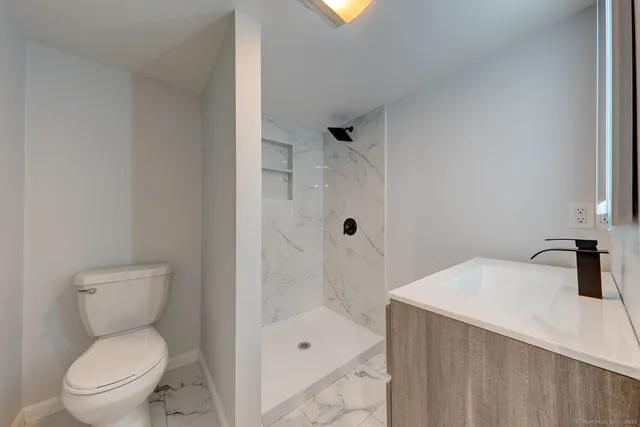 a bathroom with a sink vanity and a mirror