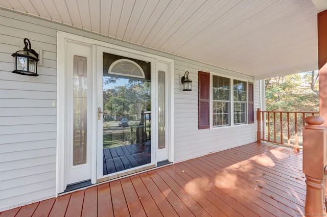 a view of balcony with wooden floor