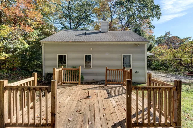 a view of outdoor space with deck and yard