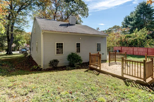a view of backyard with a patio