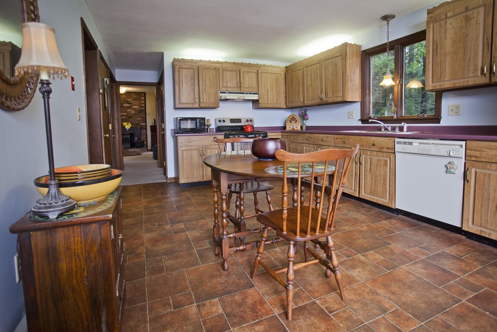 573 Westhampton Road Northampton, MA 01062 - Photo 11 of 30 a kitchen with a sink cabinets and window