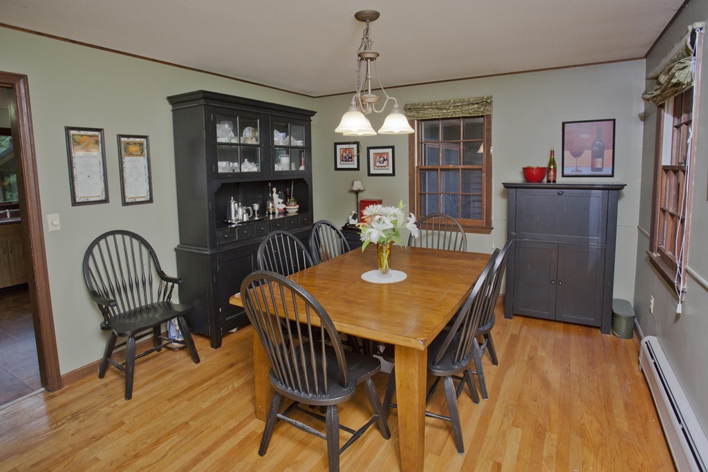 573 Westhampton Road Northampton, MA 01062 - Photo 13 of 30 a view of a dining room with furniture wooden floor and chandelier