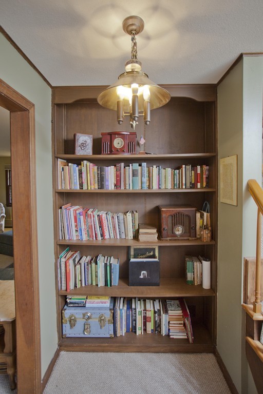 573 Westhampton Road Northampton, MA 01062 - Photo 16 of 30 a book shelf with lots of books on shelf