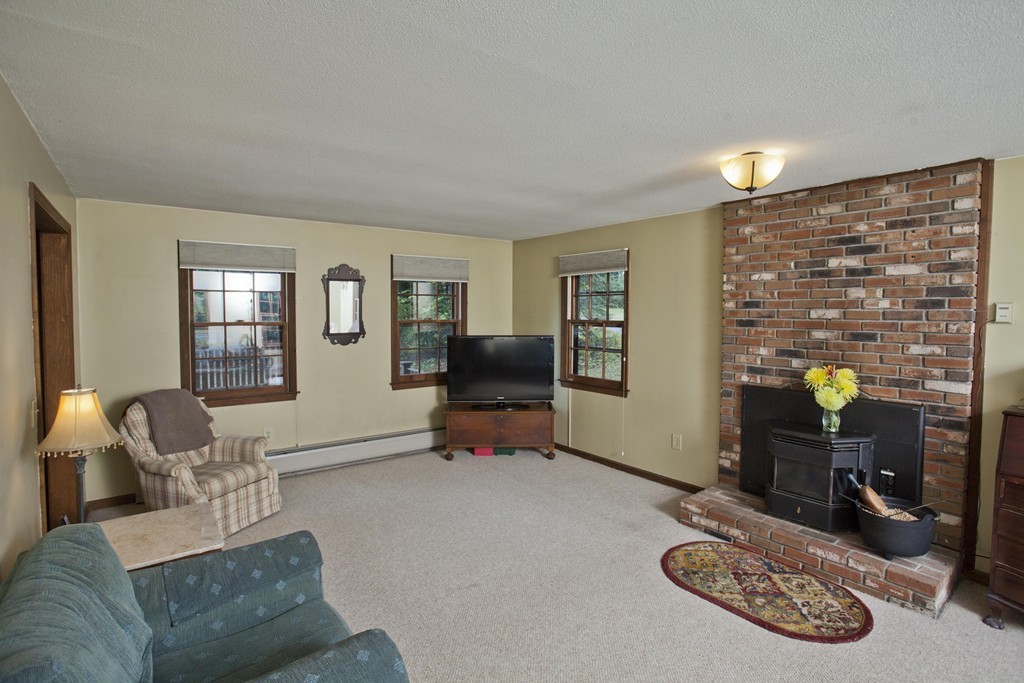 573 Westhampton Road Northampton, MA 01062 - Photo 20 of 30 a living room with furniture and a lamp