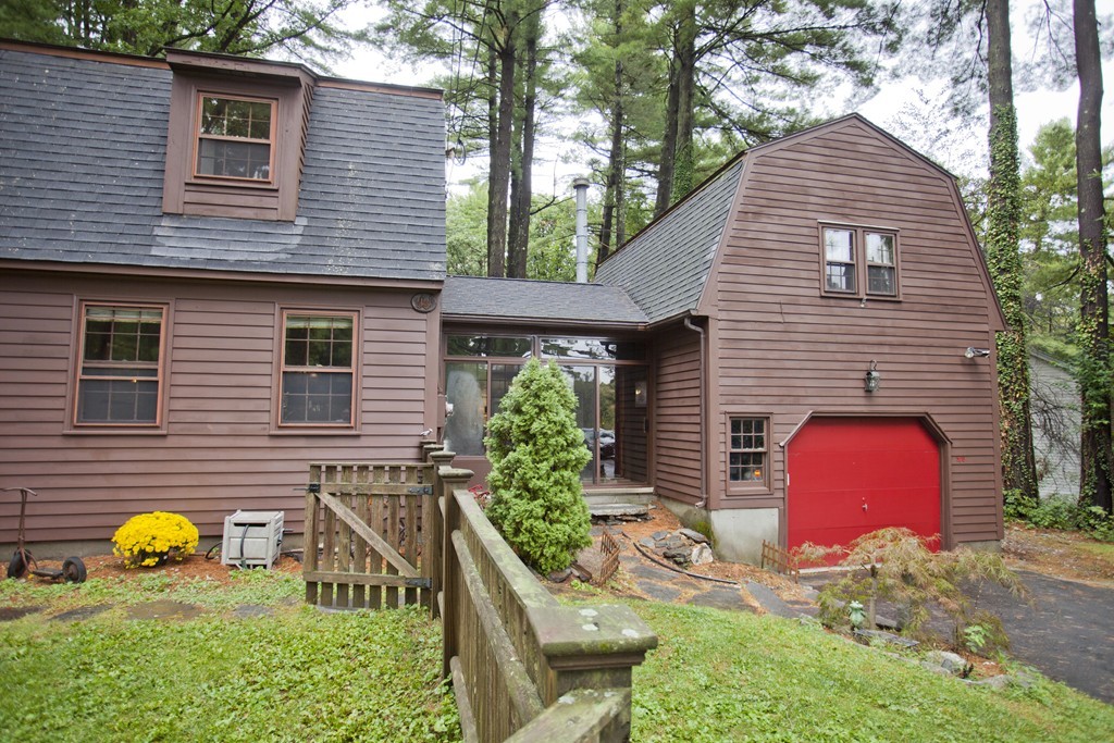 573 Westhampton Road Northampton, MA 01062 - Photo 2 of 30 a yellow house with trees in front of it