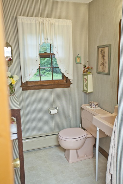 573 Westhampton Road Northampton, MA 01062 - Photo 22 of 30 a white toilet sitting next to a bathroom sink