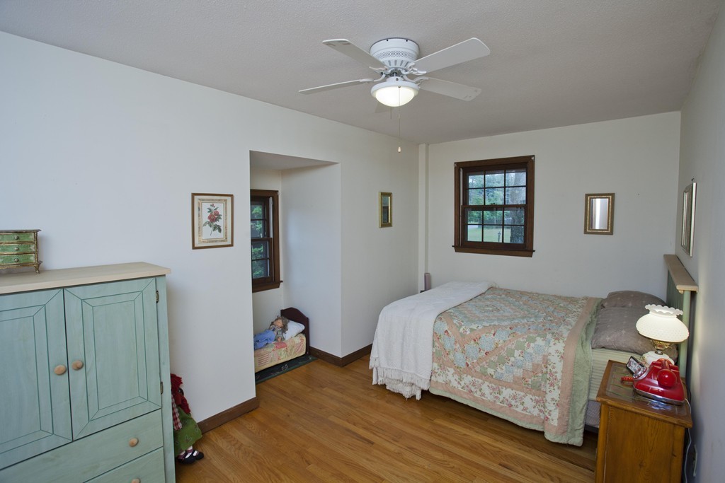 573 Westhampton Road Northampton, MA 01062 - Photo 28 of 30 a bedroom with a bed and a chandelier