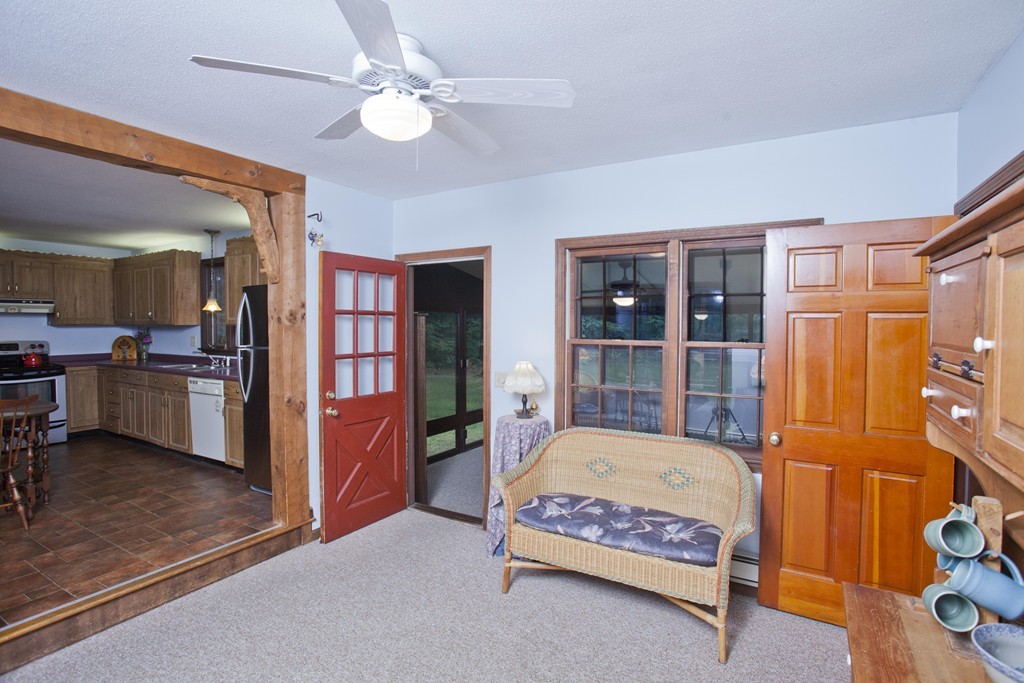 573 Westhampton Road Northampton, MA 01062 - Photo 8 of 30 a bedroom with a bed and a chandelier
