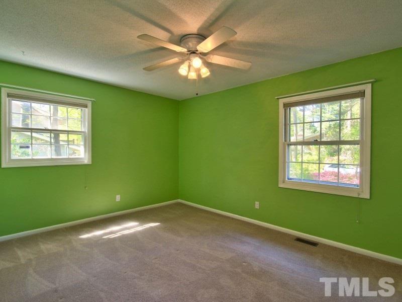 509 Old Farm Road Raleigh, NC 27606 - Photo 15 of 22 Three bedrooms in this home. This bedroom has carpet, large closet and these windows let so much natural light in!