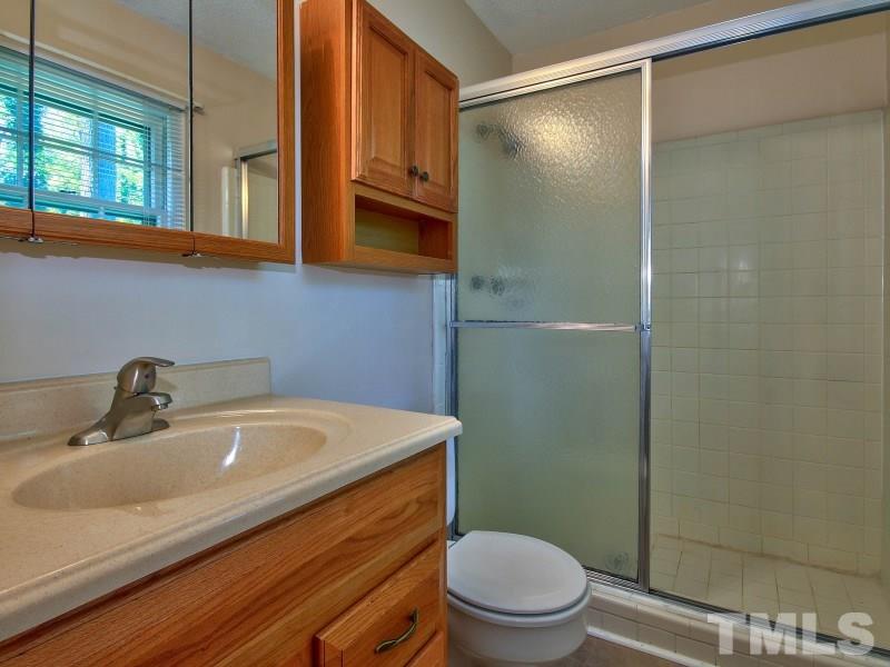 509 Old Farm Road Raleigh, NC 27606 - Photo 17 of 22 Full bath with 2 linen closets in the hallway for additional space!