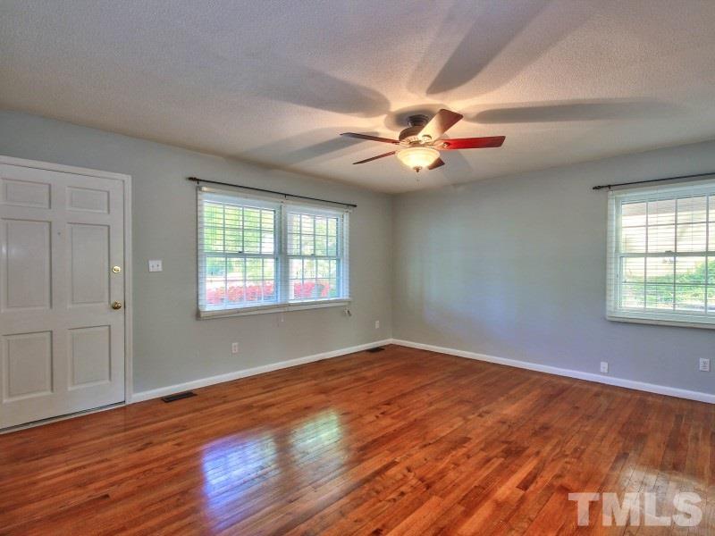 509 Old Farm Road Raleigh, NC 27606 - Photo 4 of 22 Beautiful hardwoods in this living room and lots of natural light!