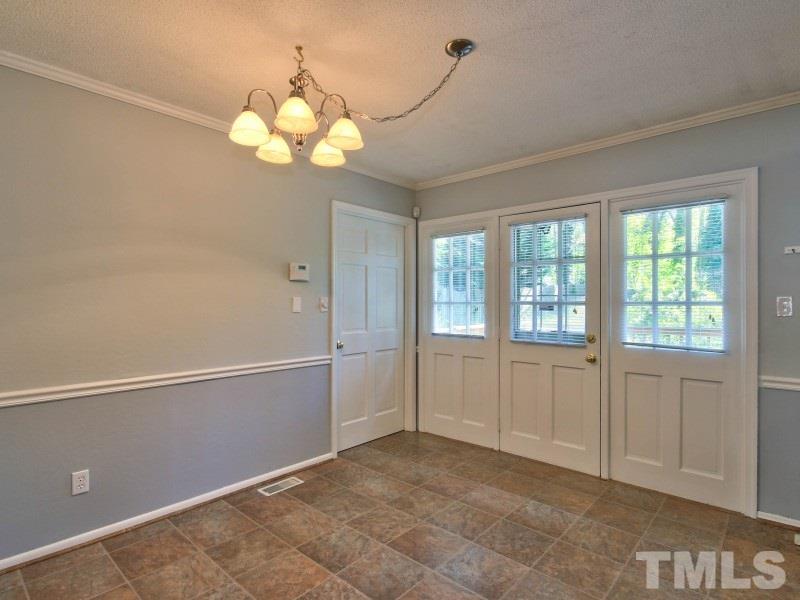 509 Old Farm Road Raleigh, NC 27606 - Photo 7 of 22 Separate dining room is open to the kitchen and the living room for easy entertaining!