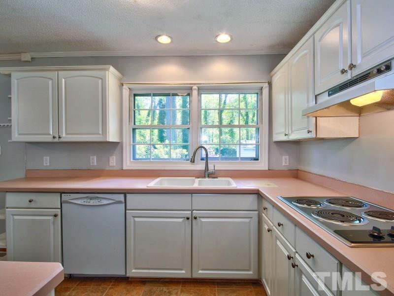 509 Old Farm Road Raleigh, NC 27606 - Photo 10 of 22 Another view of the kitchen. There is also a laundry room off of the kitchen for extra convenience.