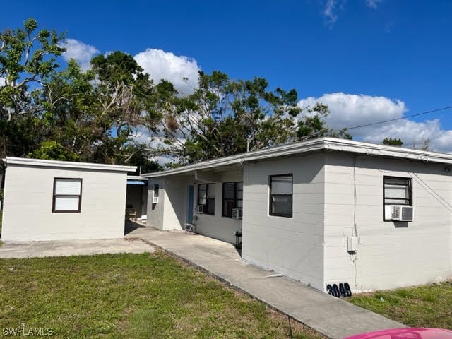 3049 2nd Street Fort Myers, FL 33916 - Photo 1 of 12 a front view of a house with garden