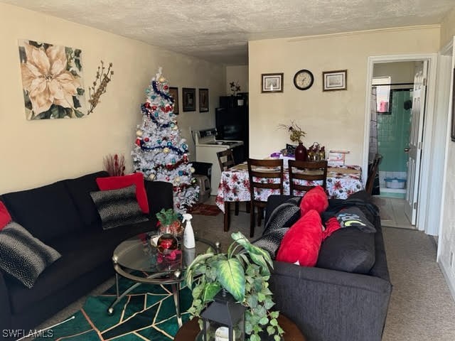 3049 2nd Street Fort Myers, FL 33916 - Photo 2 of 12 a living room with furniture chess board and a couch