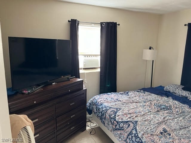 3049 2nd Street Fort Myers, FL 33916 - Photo 3 of 12 a bedroom with a bed and a flat screen tv