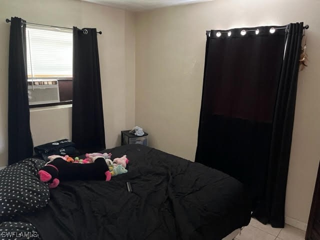 3049 2nd Street Fort Myers, FL 33916 - Photo 4 of 12 a bedroom with a bed and a window