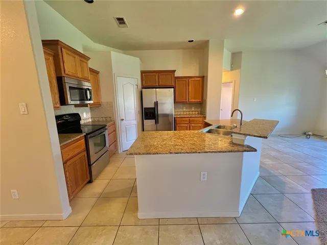 a view of a kitchen with a sink