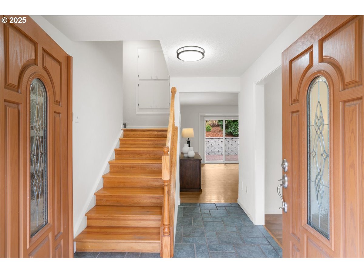 7244 Bates Road South Salem, OR 97306 - Photo 8 of 48 a view of front door with hallway and wooden floor