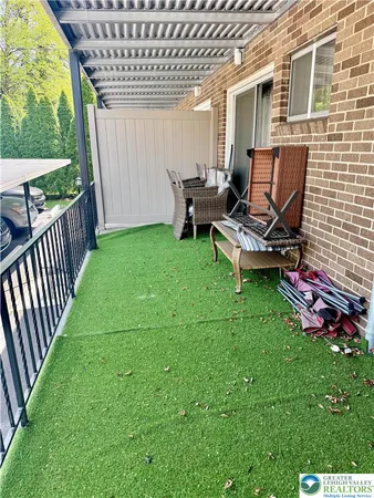 a view of a backyard with sitting area