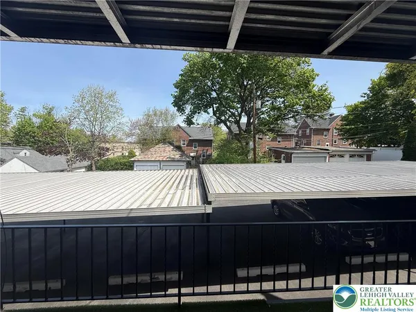 a view of a backyard with jacuzzi