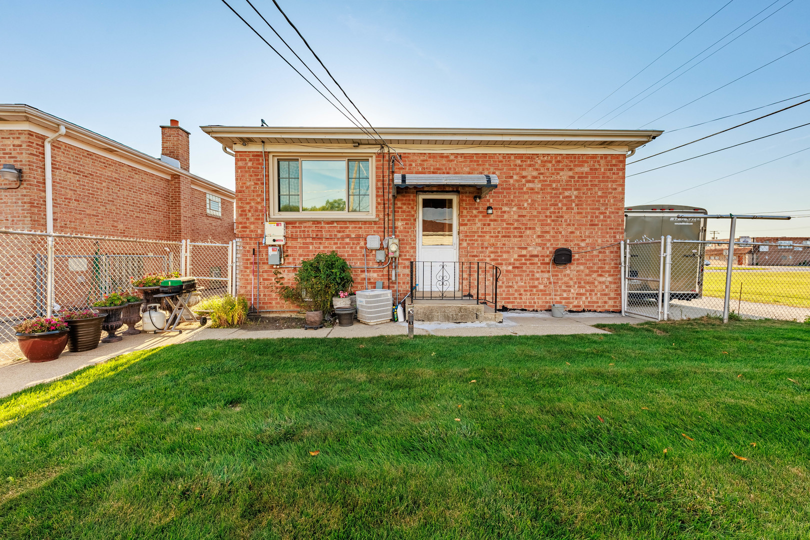 491 Escanaba Avenue Calumet City, IL 60409 - Photo 11 of 43 a view of a backyard with sitting area