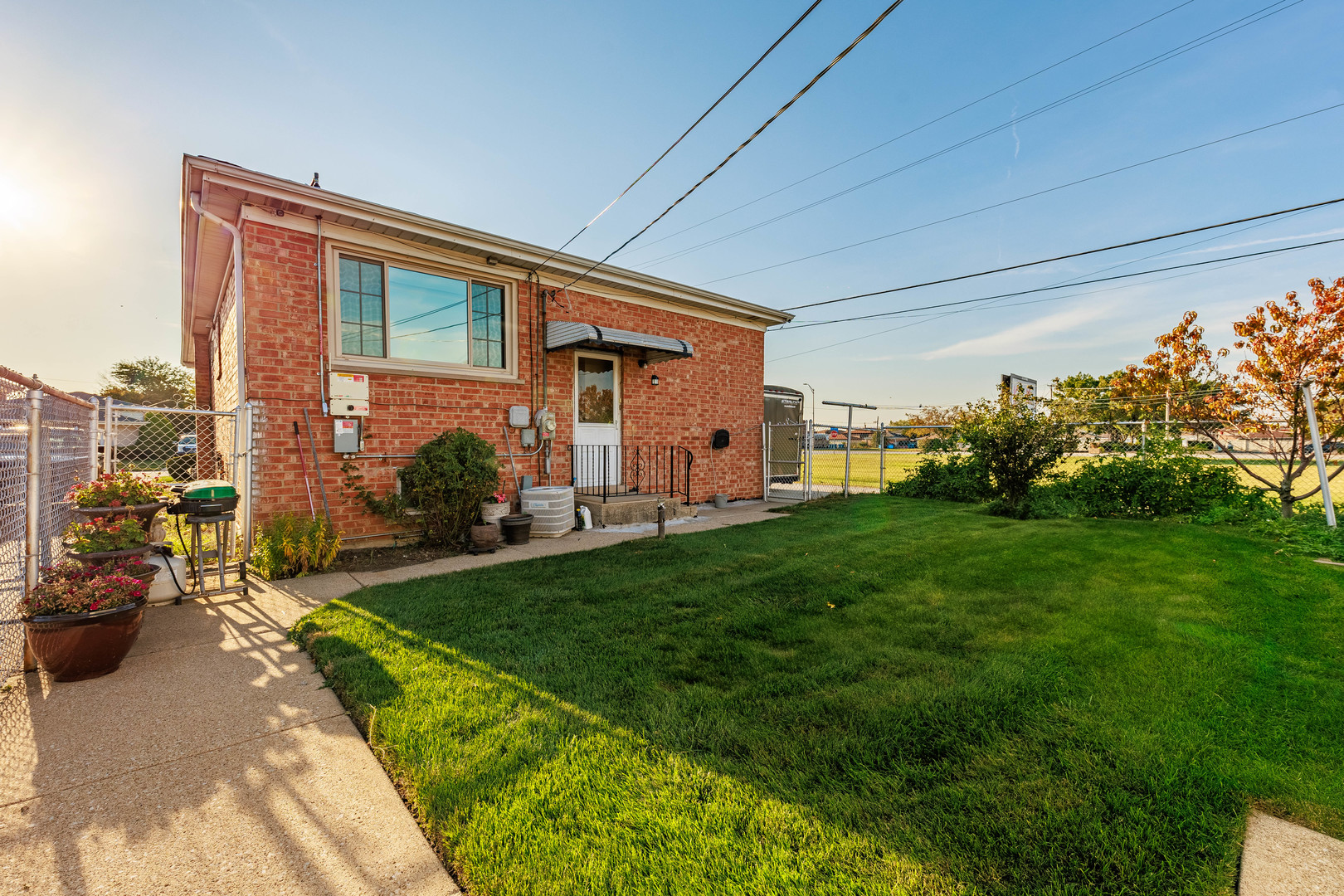 491 Escanaba Avenue Calumet City, IL 60409 - Photo 12 of 43 a front view of house with yard and outdoor seating