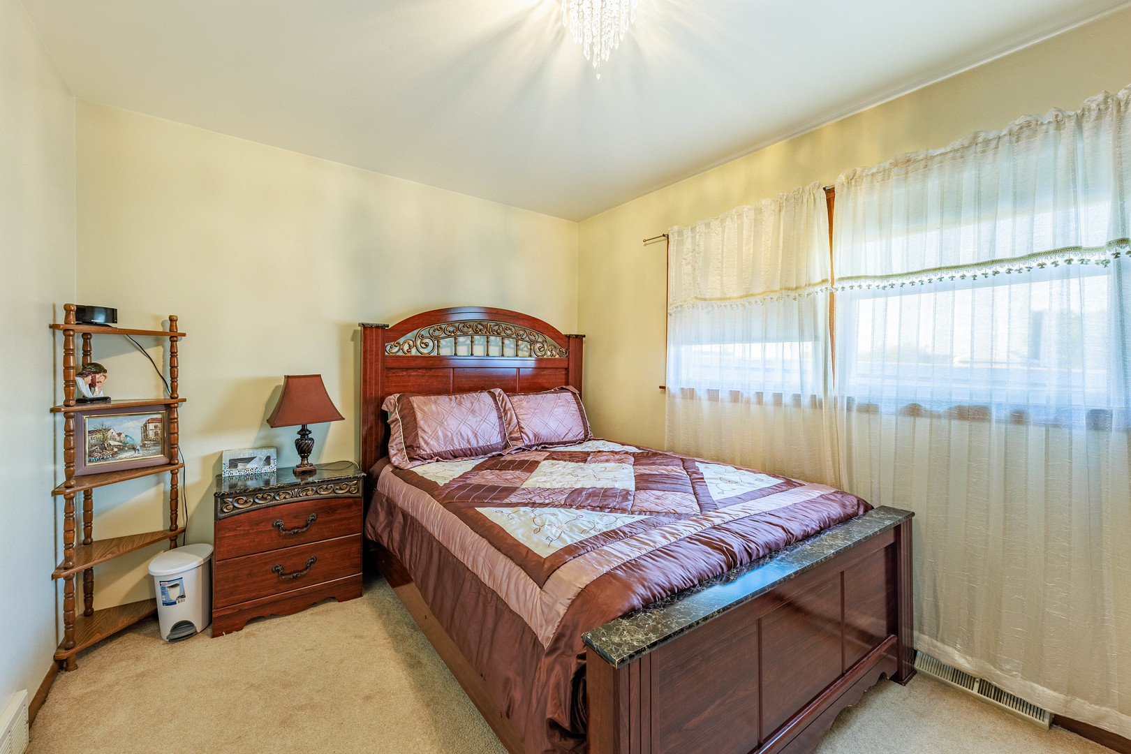 491 Escanaba Avenue Calumet City, IL 60409 - Photo 13 of 43 a bedroom with a bed and a window