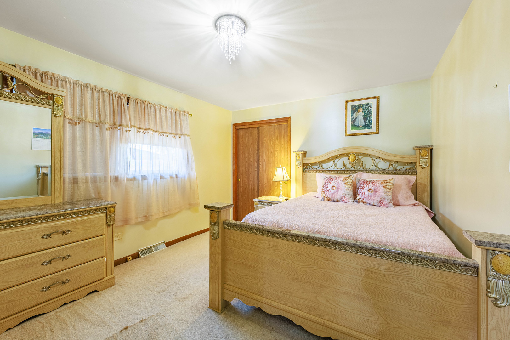 491 Escanaba Avenue Calumet City, IL 60409 - Photo 22 of 43 a bedroom with a bed and a window