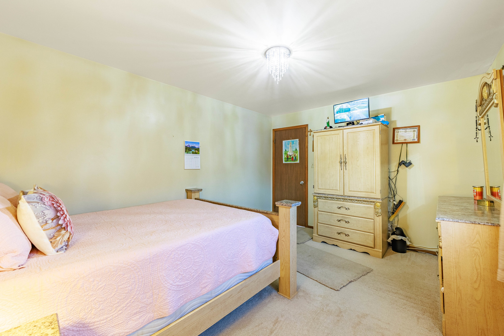 491 Escanaba Avenue Calumet City, IL 60409 - Photo 23 of 43 a bedroom with a bed and a refrigerator