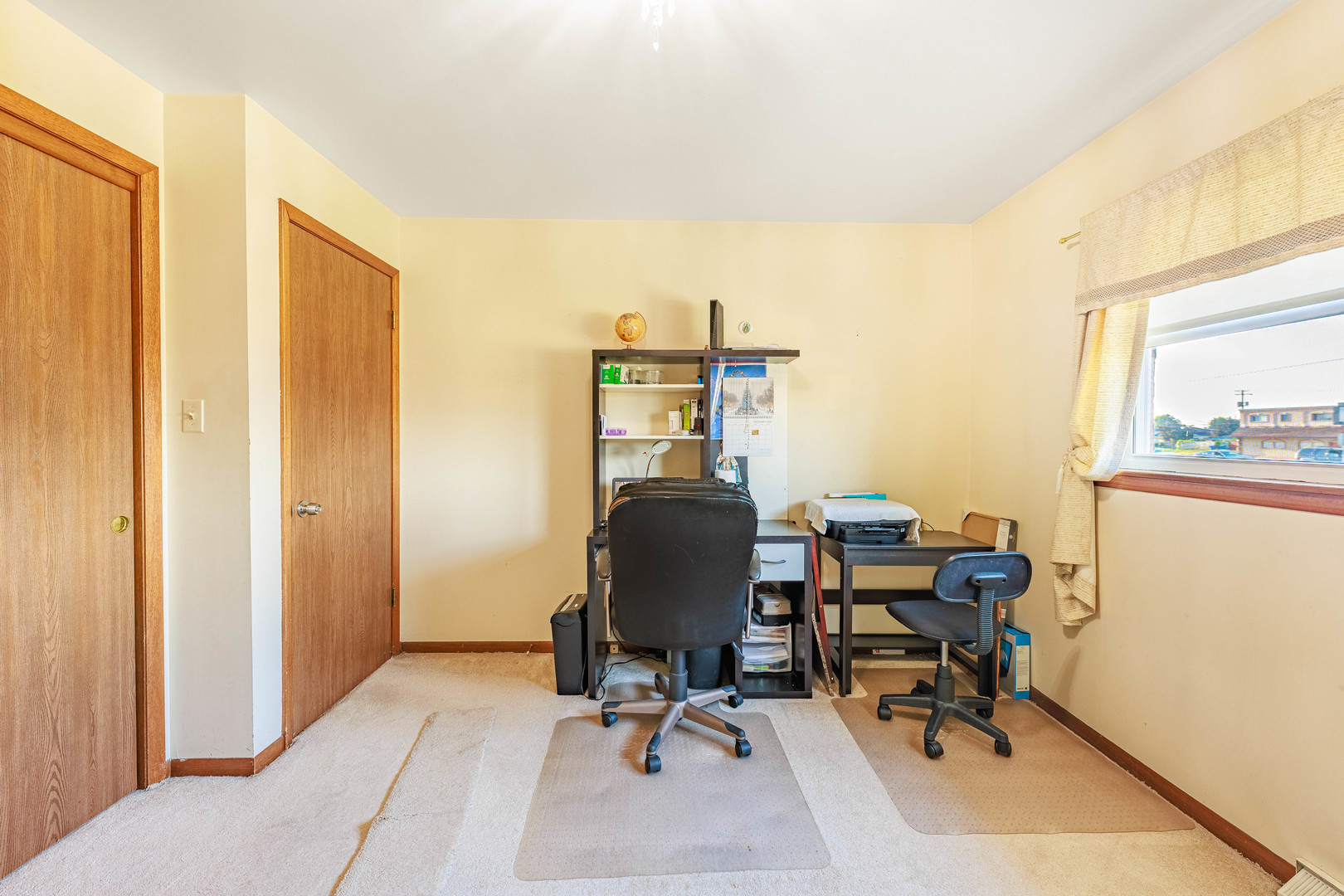 491 Escanaba Avenue Calumet City, IL 60409 - Photo 26 of 43 a view of a workspace with furniture and a window