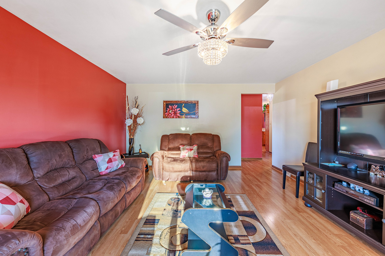 491 Escanaba Avenue Calumet City, IL 60409 - Photo 29 of 43 a living room with furniture and a flat screen tv
