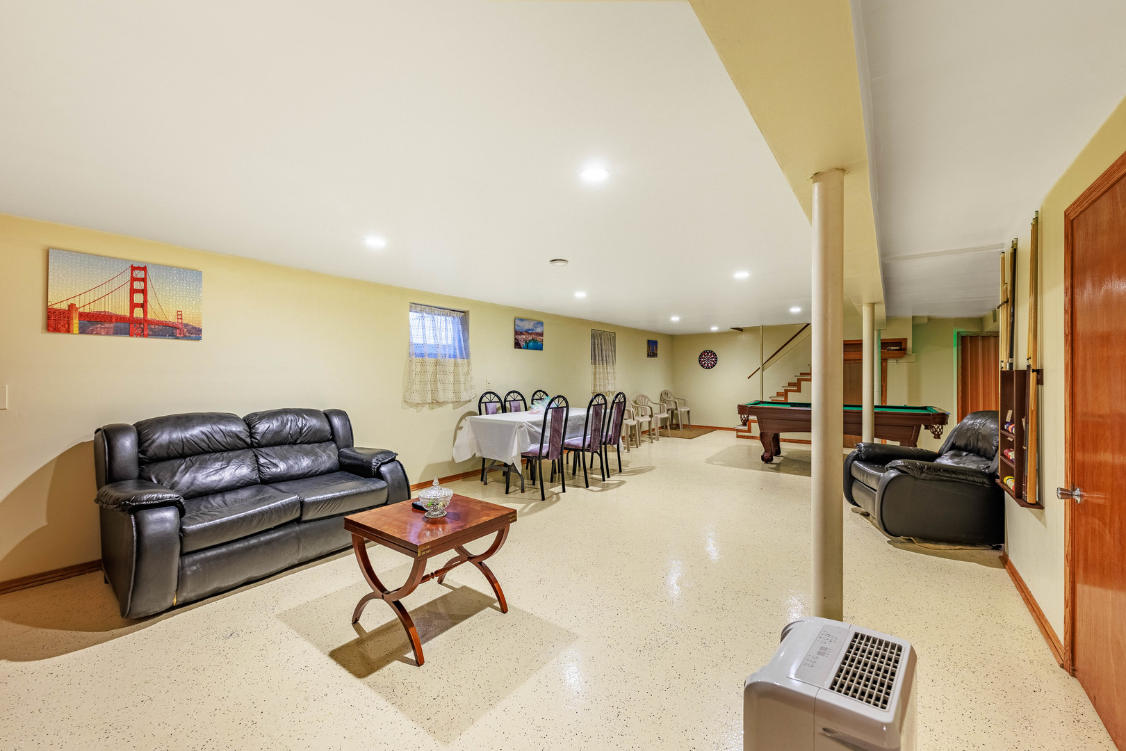 491 Escanaba Avenue Calumet City, IL 60409 - Photo 35 of 43 a living room with furniture and a flat screen tv