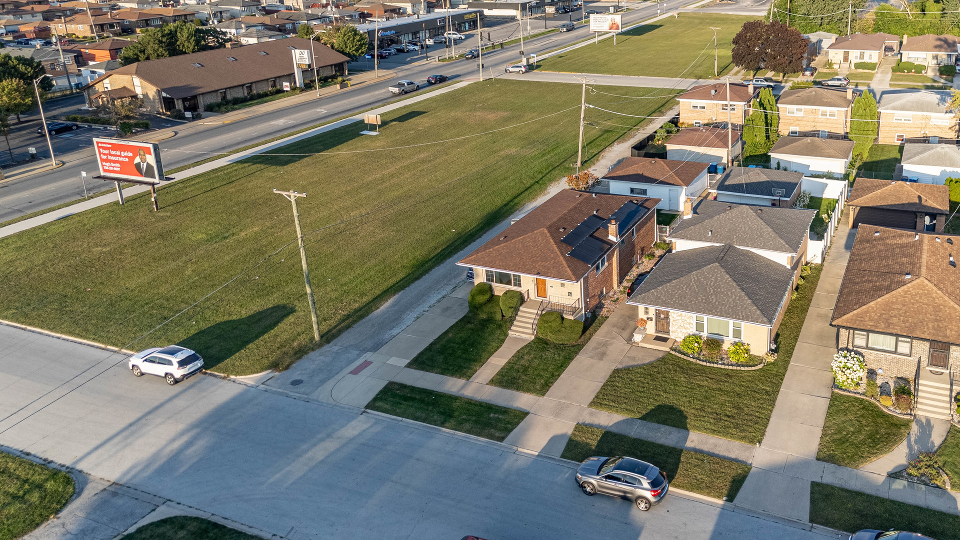 491 Escanaba Avenue Calumet City, IL 60409 - Photo 4 of 43 an aerial view of a houses with a city street