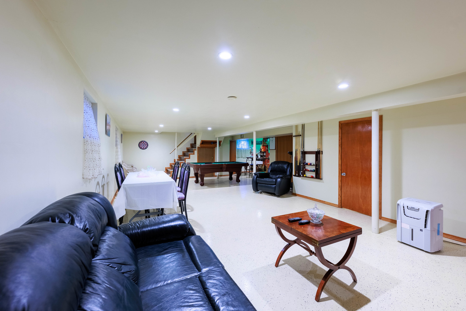 491 Escanaba Avenue Calumet City, IL 60409 - Photo 43 of 43 a living room with furniture and a flat screen tv