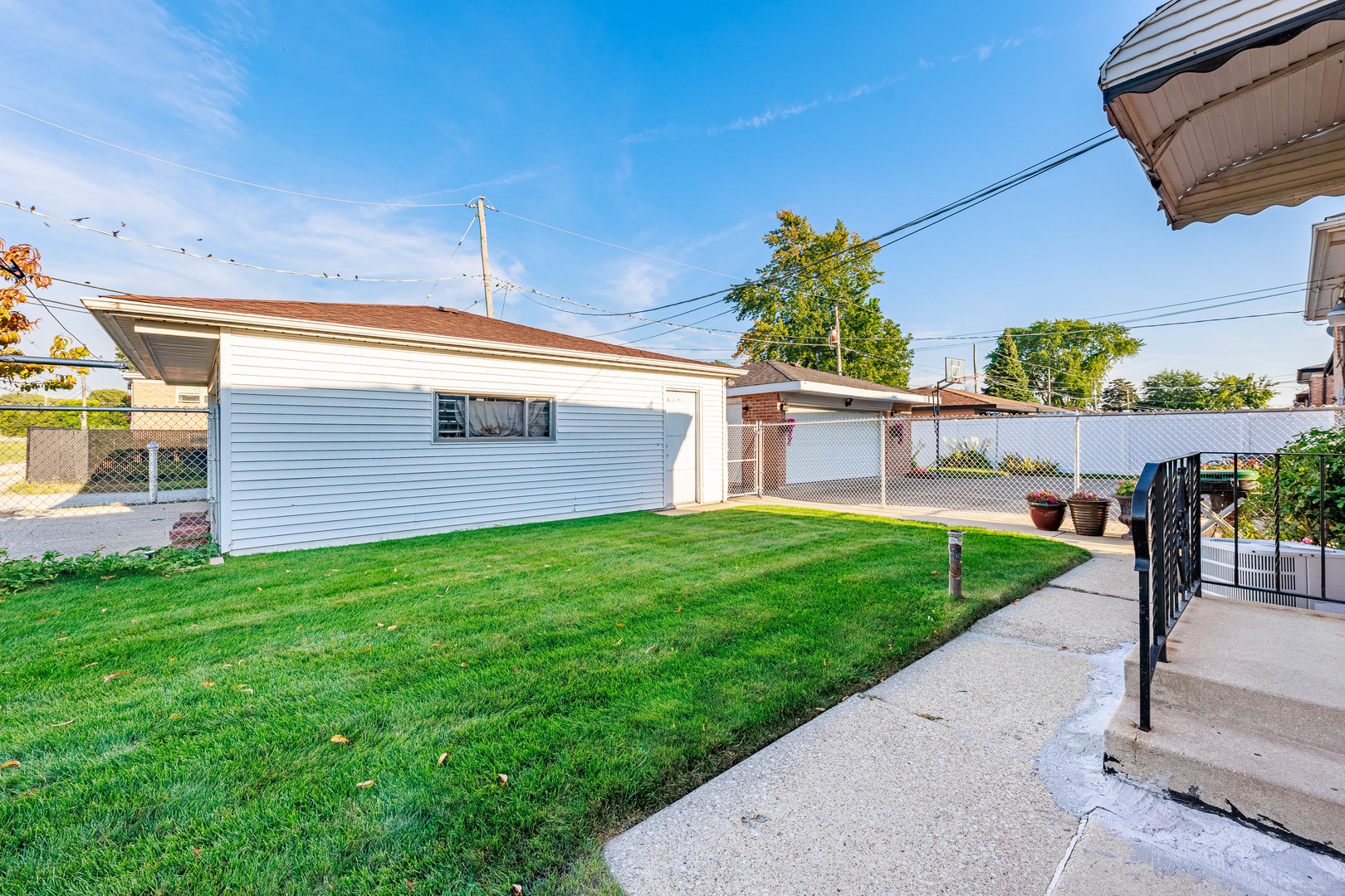 491 Escanaba Avenue Calumet City, IL 60409 - Photo 9 of 43 a view of a backyard with plants