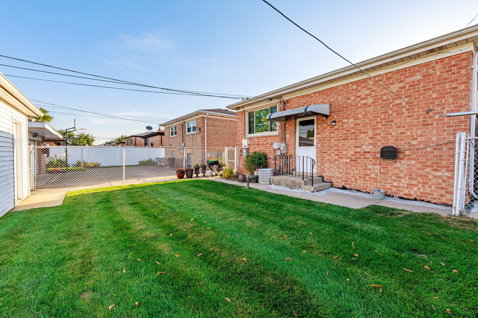 491 Escanaba Avenue Calumet City, IL 60409 - Photo 10 of 43 a view of a back yard of the house