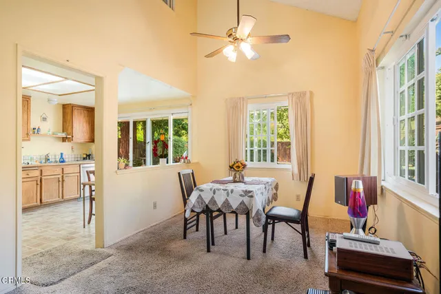 a view of a livingroom with furniture and a window