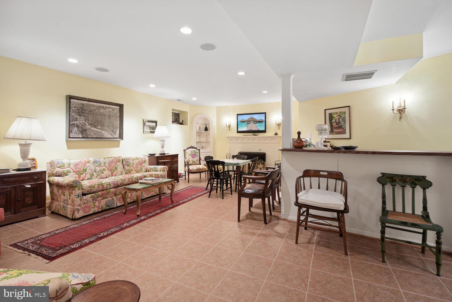 6209 Brookside Drive Chevy Chase, MD 20815 - Photo 36 of 51 Recrecation room with fireplace