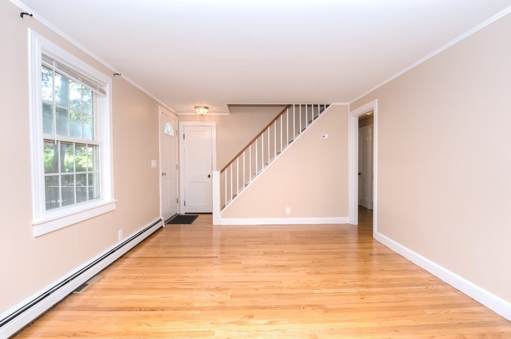 165 R Green Street Stoneham, MA 02180 - Photo 18 of 42 a view of entryway and hall with wooden floor