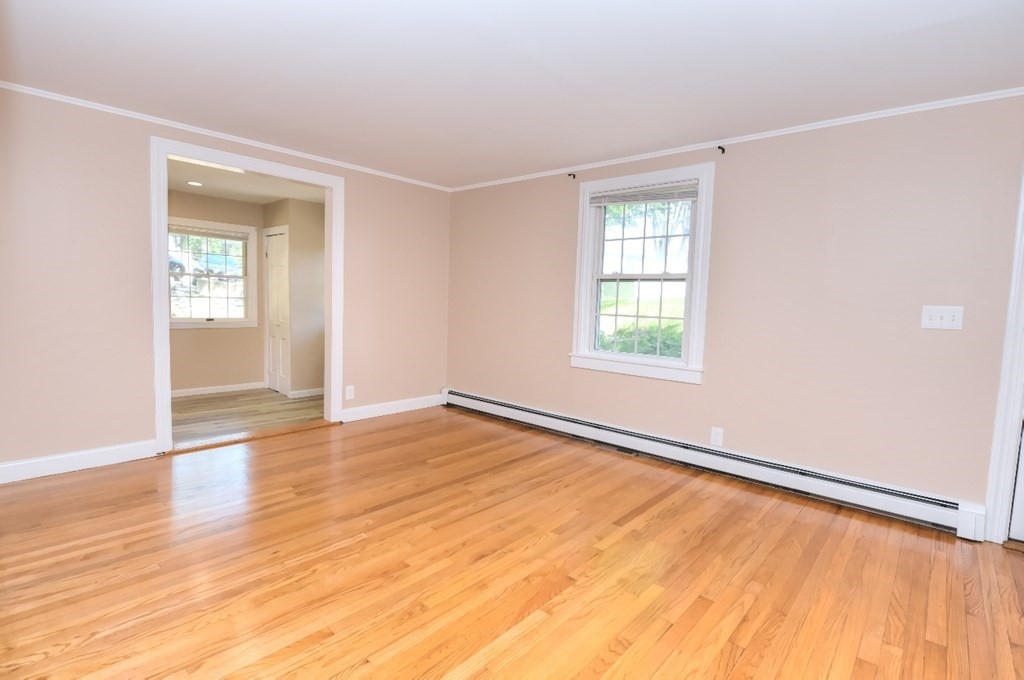 165 R Green Street Stoneham, MA 02180 - Photo 19 of 42 an empty room with wooden floor and windows