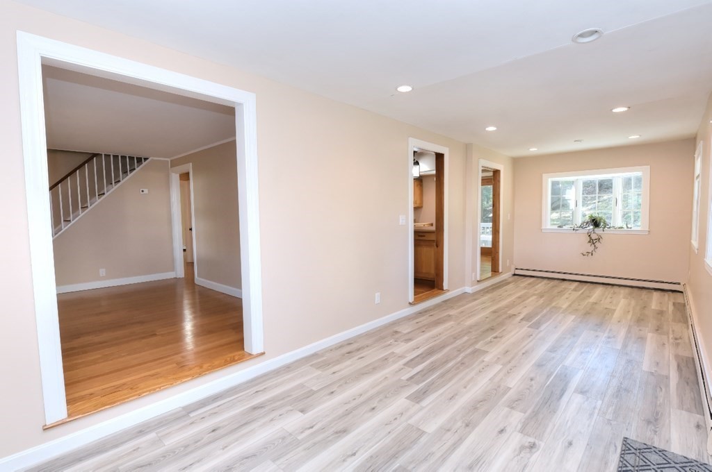 165 R Green Street Stoneham, MA 02180 - Photo 23 of 42 a view of empty room with wooden floor