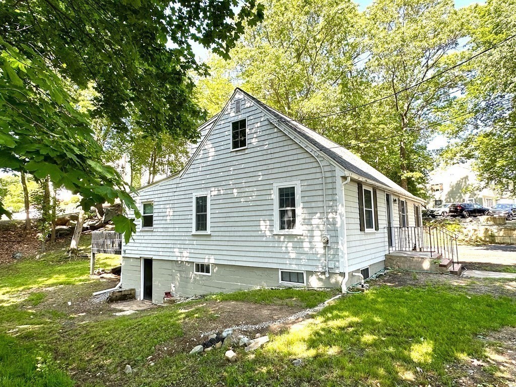 165 R Green Street Stoneham, MA 02180 - Photo 3 of 42 a view of a house with a yard